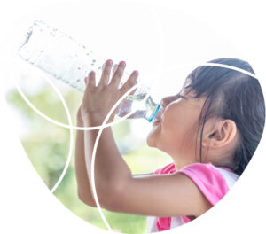 young girl drinking out of water bottle