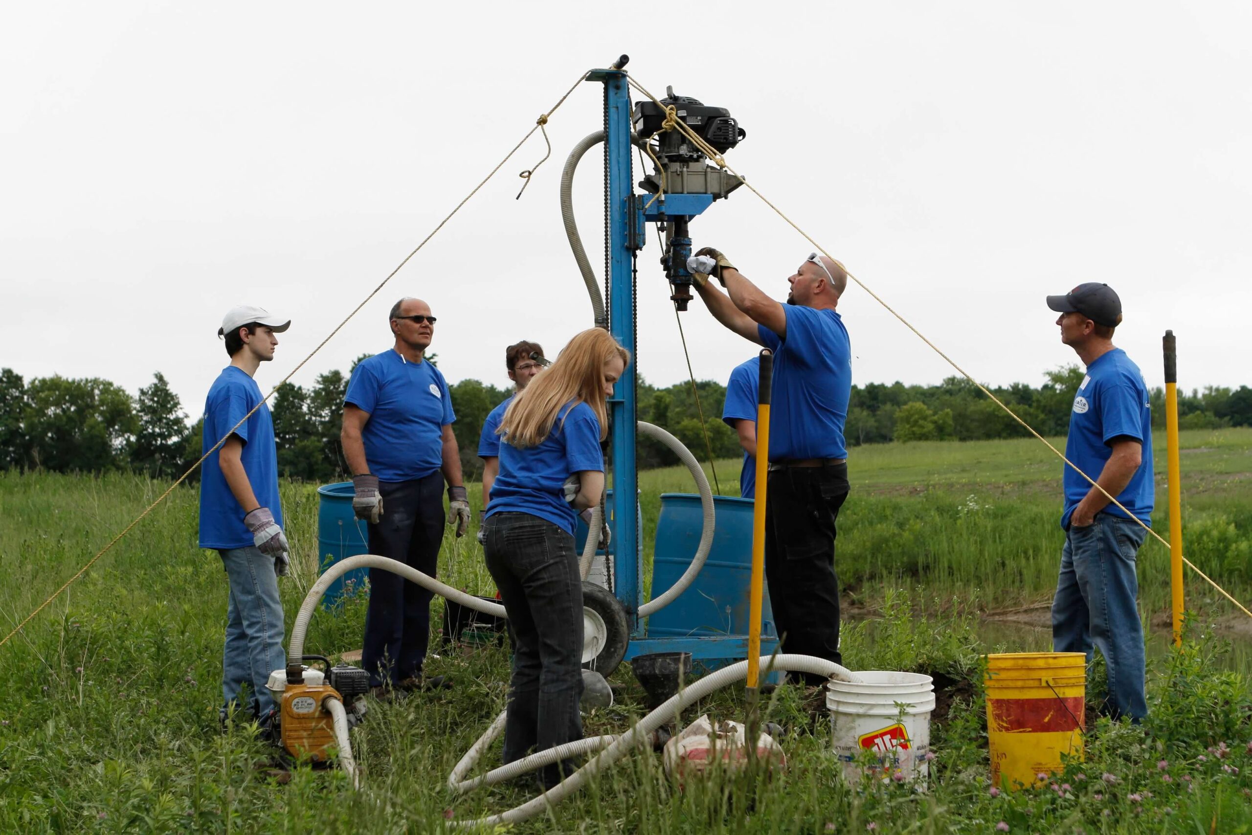 A Water Team setting up a well.